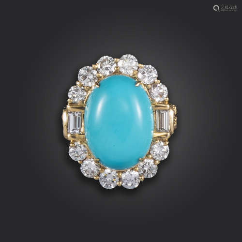 A turquoise and diamond cluster ring, the oval turquoise cabochon set within a surround of