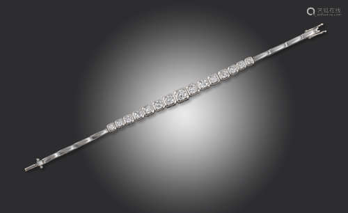 A diamond line bracelet, set with graduated round brilliant-cut diamonds in square white gold