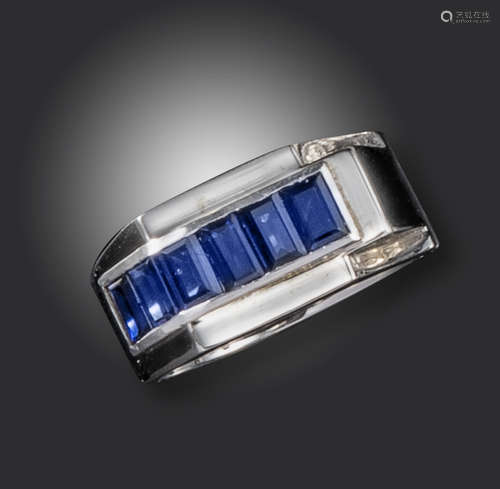 A French sapphire ring, of geometric design, set in white gold with six baguette-shaped sapphires,