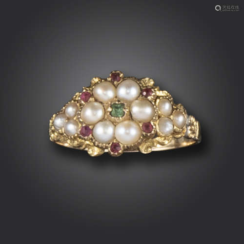 A Regency gem-set gold ring, of flowerhead design, set with an emerald, seed pearls and red