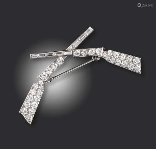 A diamond-set crossed rifles brooch by Cartier, the barrels set with baguette-shaped diamonds,