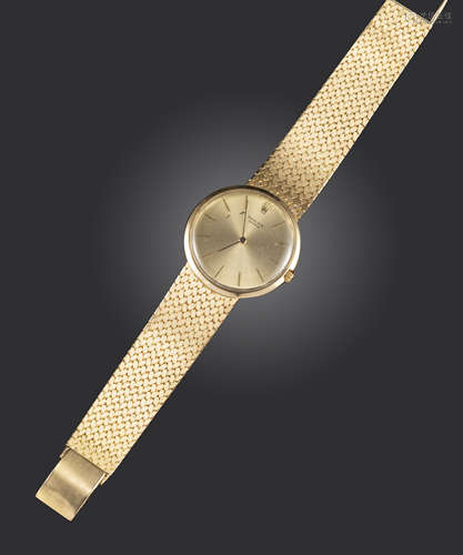 A gentleman's gold wristwatch by Rolex, the signed dial with baton numerals, model number 9577,