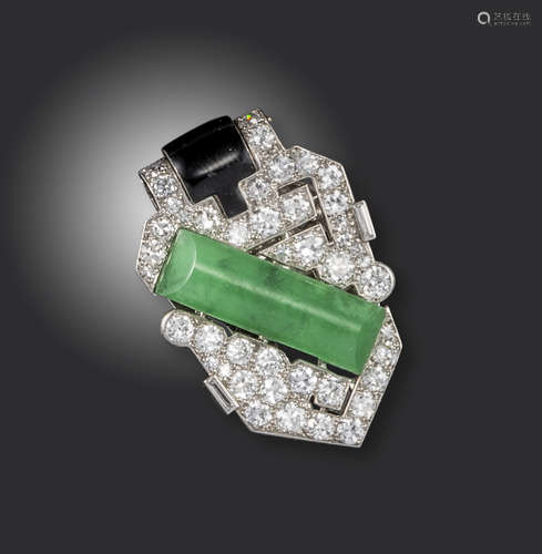 An Art Deco jade, diamond and black enamel clip brooch by Cartier, of geometric design, set with a