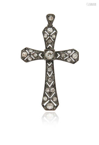 A diamond cruciform pendant, set with graduated old cushion-shaped diamonds millegrain-set in