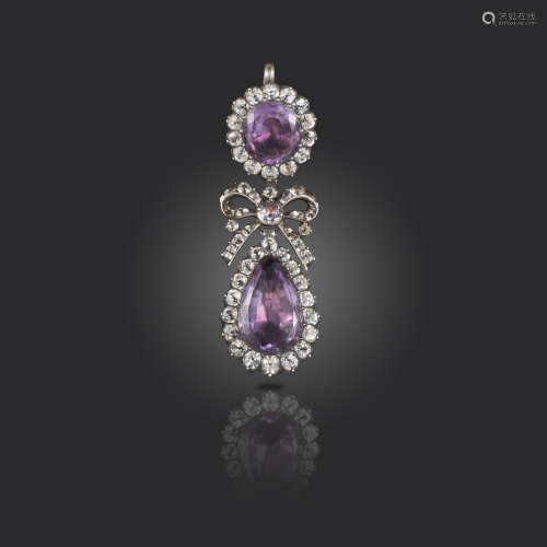 An 18th century amethyst and paste-set silver pendant, the amethyst and white paste clusters suspend