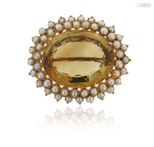 A Victorian citrine and seed pearl brooch, the oval-shaped citrine set within a surround of seed