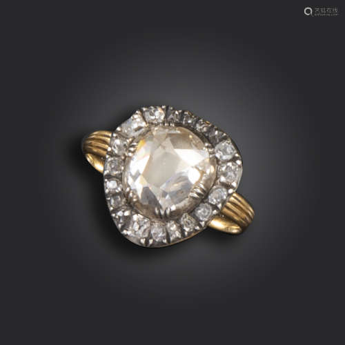 A George III diamond cluster ring, centred with a foil-backed pear-shaped diamond in cut-down silver