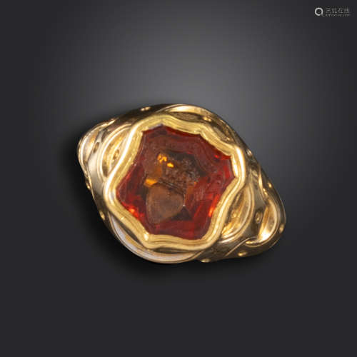 A late 19th century gold shield-form signet ring for the Douglas clan, the hessonite garnet intaglio