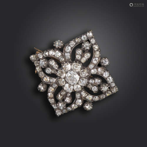 A George III diamond quatrefoil brooch, of bombé form, set with old cushion-shaped diamonds in