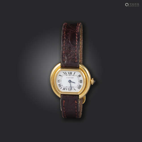 A lady's gold Ellipse wristwatch by Cartier, the signed white dial with black Roman numerals, signed