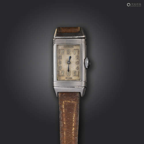 A lady's steel reverso wristwatch, the rectangular dial with Arabic numerals, manual movement,