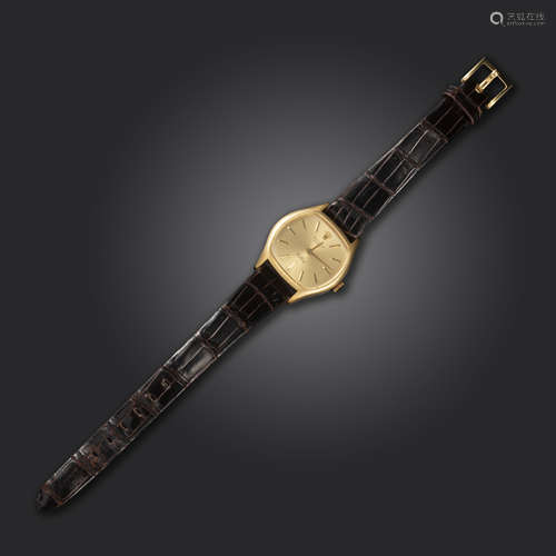 A gold Cellini wristwatch by Rolex, of tonneau form, the signed dial with gilt baton numerals,