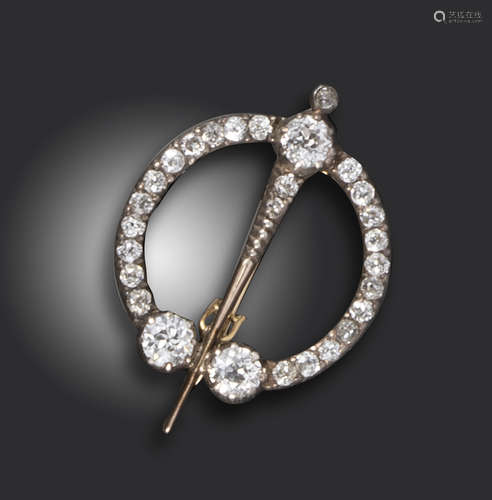 A Victorian diamond-set brooch, the stylised Scottish kilt pin set with graduated old circular-cut