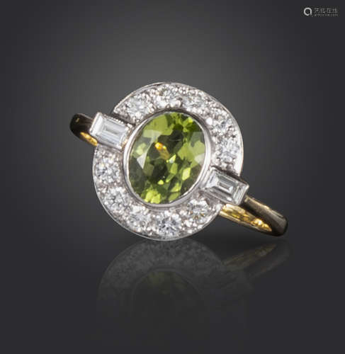 A peridot and diamond cluster ring, the oval-shaped peridot weighs approximately 1.30cts and set