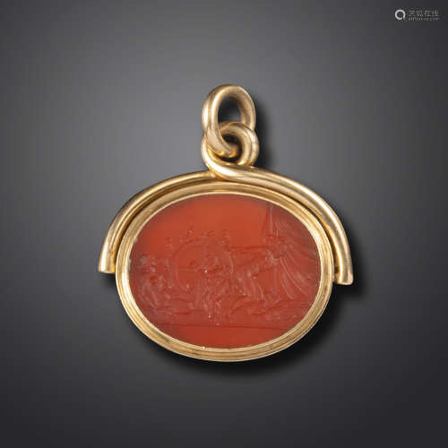 A 19th century erotic carnelian intaglio seal, depicting Cupid spinning a wheel of phalluses, two