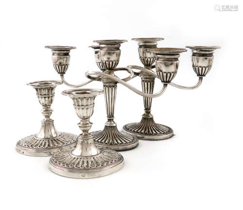 A pair of Edwardian dwarf silver candlesticks, by The Goldsmiths and Silversmiths Company, London