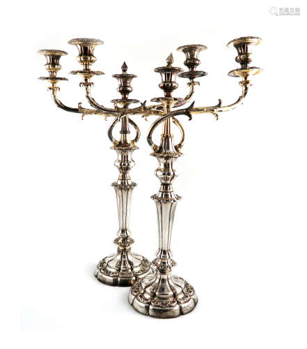 A pair of early 19th century old Sheffield plated three-light candelabra, unmarked, circa 1830,