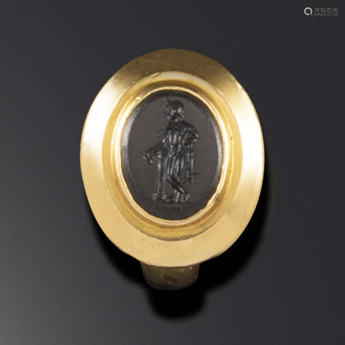 A Roman onyx intaglio depicting Dionysus, c1st - 2nd century AD, Dionysus depicted leaning on a