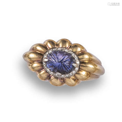 A colour-change sapphire and diamond ring by Boucheron, c1940, the carved colour-change sapphire