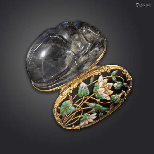 A mid 18th century carved labradorite scarab-form snuff box, the hinged blue glass cover decorated