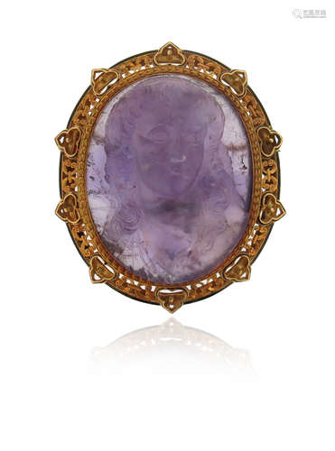 A 19th century carved amethyst cameo brooch, portraying the bust of a woman with flowing hair,