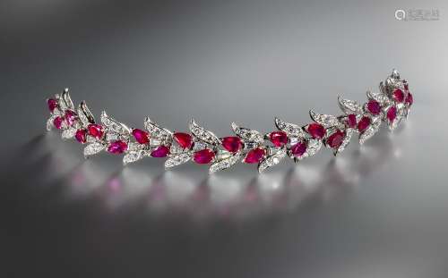 A ruby and diamond bracelet, c1960, designed as a garland of leaves, set with brilliant-cut diamonds