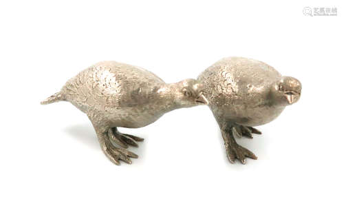 A pair of modern silver models of grouse, by Garrard and Co, London 1974, modelled in standing