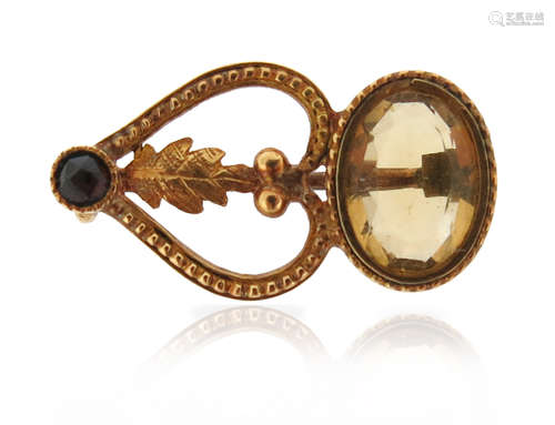 A citrine and garnet gold stylised comet brooch, set within gold pellet border, 2.2cm high