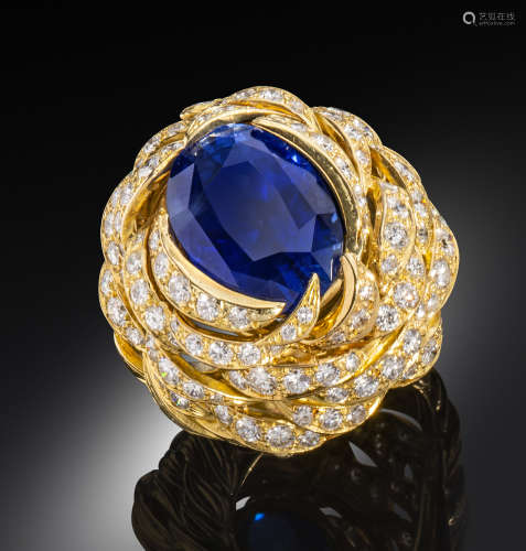 ‡ A sapphire and diamond-set yellow gold ring by Andrew Grima, designed as a birds nest, set with an