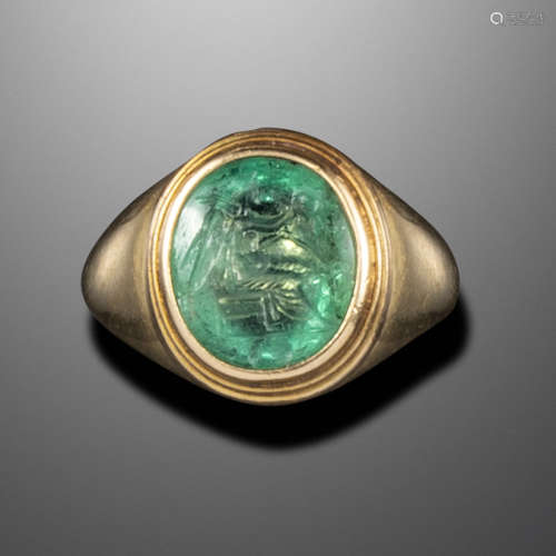 A Roman emerald intaglio depicting Victory, c1st century AD, Victory depicted seated with her wreath