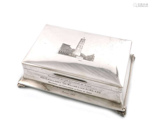 A presentation silver cigar box. by Garrard and Co, London 1958, tapering rectangular form, the