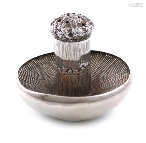 A Victorian novelty silver pepper pot, by E. Stockwell, London 1873, modelled as an upturned