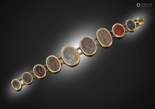 A 19th century bracelet mounted with nine oval hardstone intaglios in gold rub-over mounts and