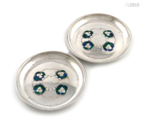 Designed by Jessie M. King, for W.H. Haseler, a pair of Edwardian Arts and Crafts silver and