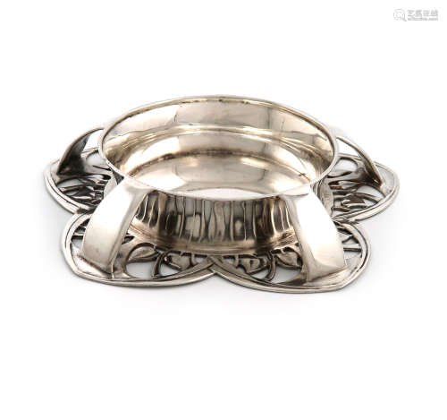 By Liberty and Co, an Edwardian Art Nouveau silver dish, Birmingham 1902, circular form, on a spread