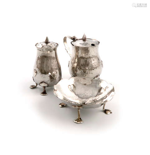 By Liberty and Co, a matched three-piece Edwardian Art Nouveau silver cruet set, Birmingham 1901 and