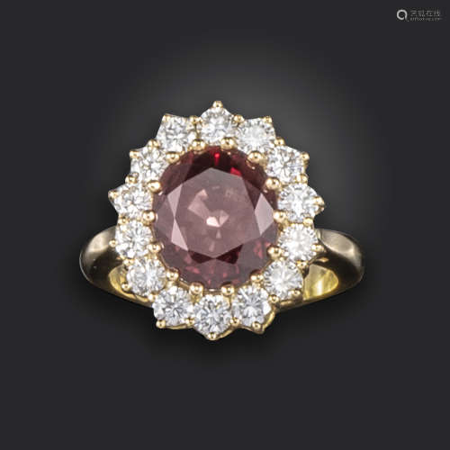 A spinel and diamond cluster ring, centred with an oval-shaped spinel weighing 4.83cts, within a