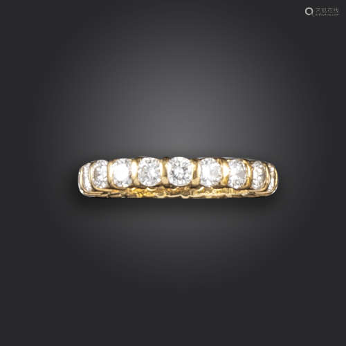 A diamond full circle eternity ring, set with round brilliant-cut diamonds in yellow gold, 18ct