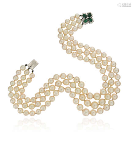 A three-row cultured pearl necklace, with an emerald and diamond quatrefoil clasp, set in white