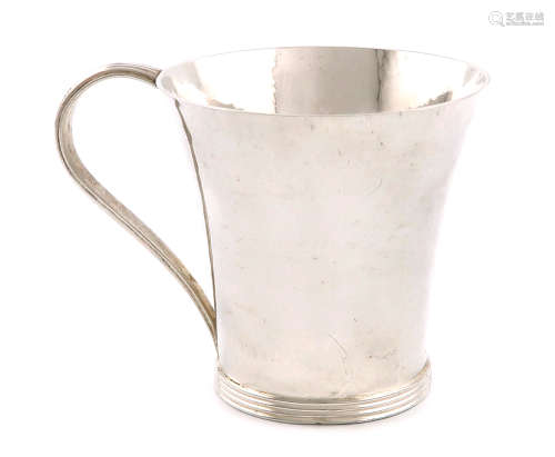 By H. G. Murphy, a silver mug, London 1935, also marked with the Falcon mark, tapering circular