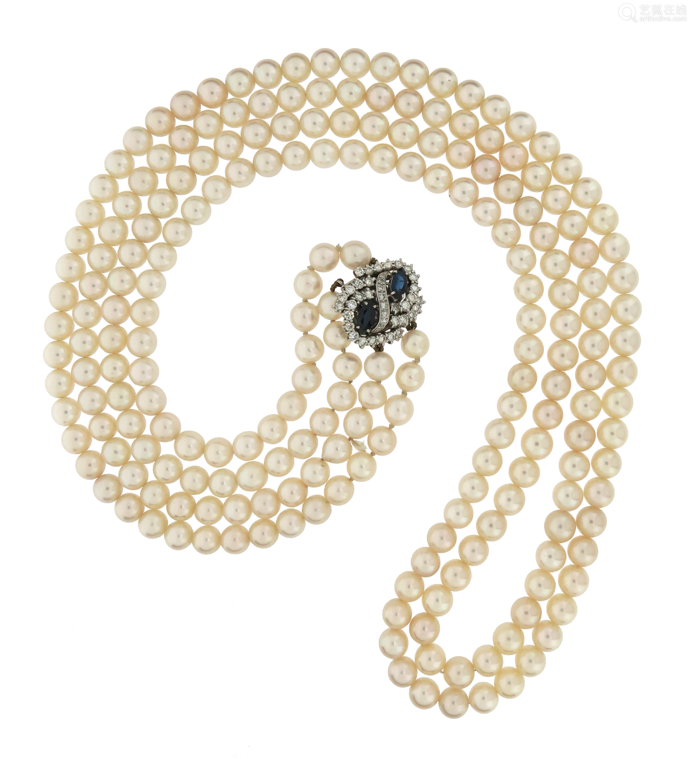 a two-row cultured pearl necklace set with a sapphire and