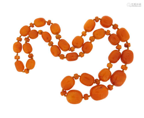 A single-row amber bead necklace, the beads graduate from 17mm to 30mm, 112cm, 243.9g total