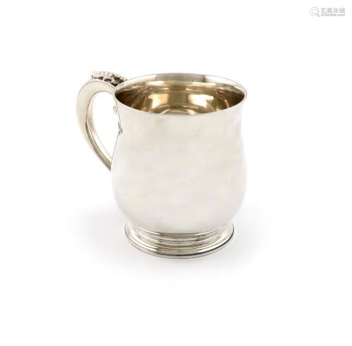 A silver mug, by F.T Ray and Co, London 1936, baluster form, the scroll handle with cut-card and