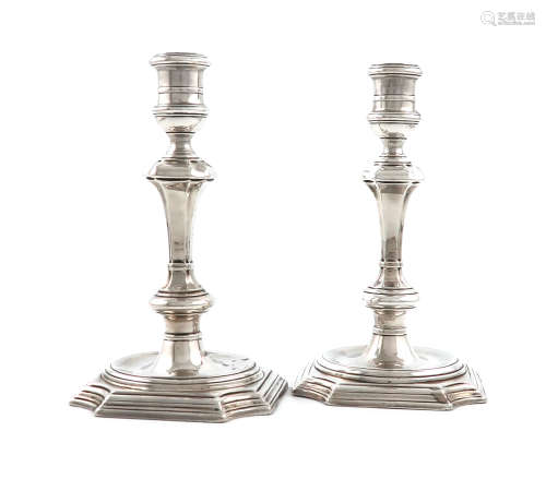 A matched pair of George II Irish cast silver candlesticks, probably by Phillip Kinnersly or Peter