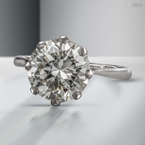A diamond solitaire ring, the round brilliant-cut diamond weighs 7.08cts, claw-set in white gold,