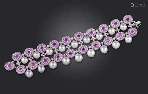 A pink sapphire and diamond bracelet by Scavia, the two rows of pink sapphire clusters set with