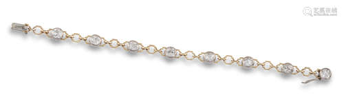 A diamond line bracelet, the eight old circular-cut diamonds set in platinum collets with yellow