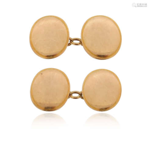 A pair of gold cufflinks, the plain oval discs in 15ct gold, 17mm high