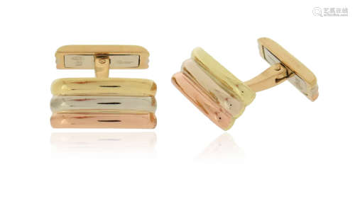 A pair of fluted gold cufflinks by Cartier, in three-colour gold, signed and dated 1999, 18mm high