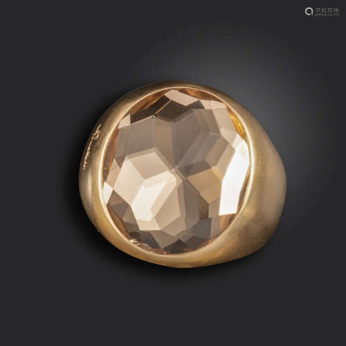 A gold 'Narciso' ring by Pomellato, set with an oval-shaped citrine in brushed pink gold, signed